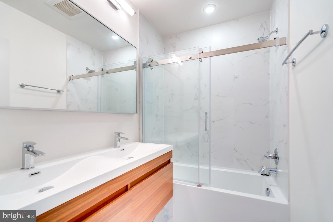 117 T Street Northwest, Unit 2 Washington, DC 20001 - Photo 26 of 32 a bathroom with a bathtub and a sink