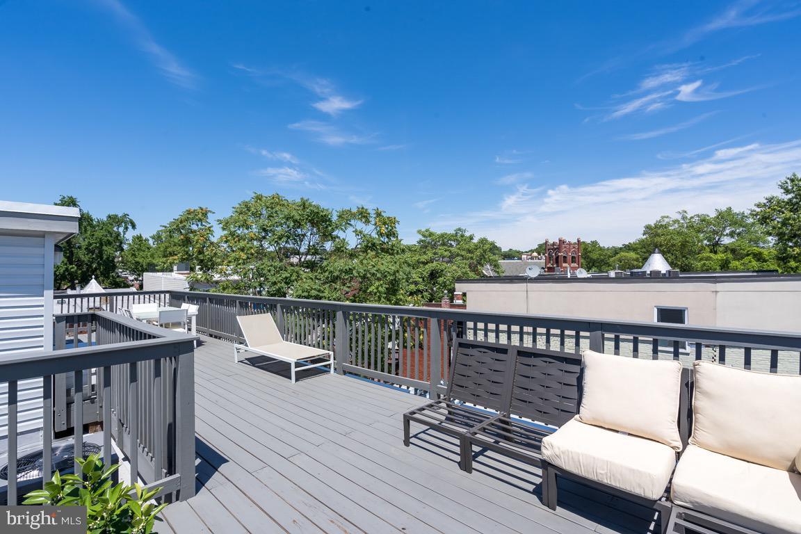117 T Street Northwest, Unit 2 Washington, DC 20001 - Photo 28 of 32 a view of a balcony with wooden floor and outdoor seating