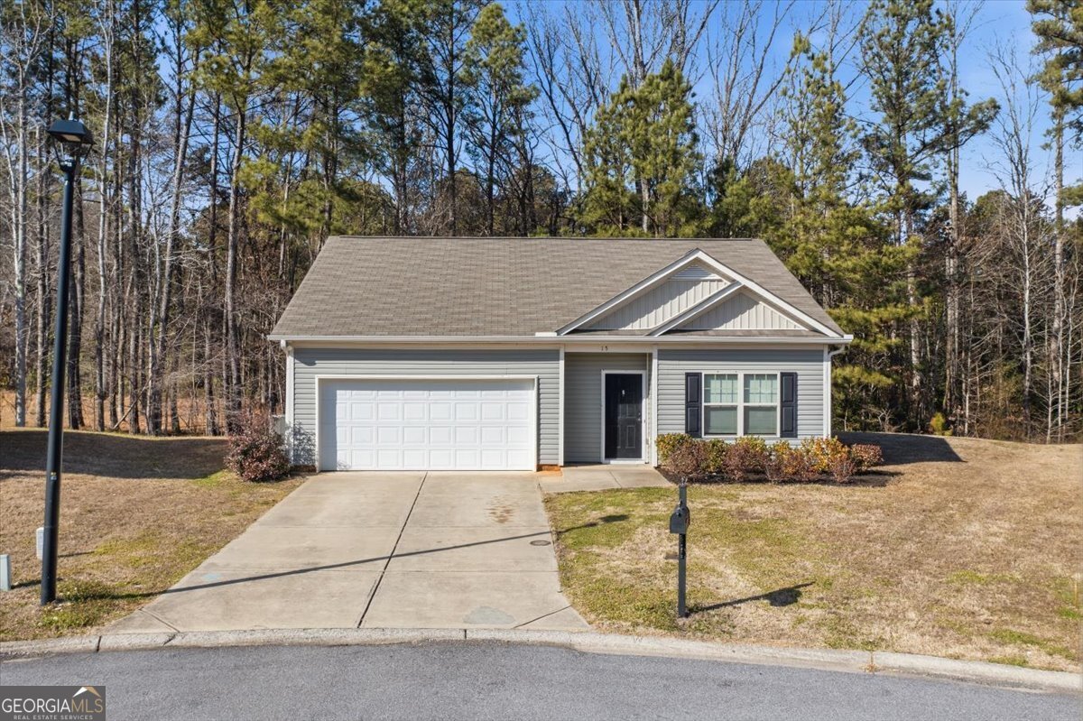 15 Grandberry Court Southwest Rome, GA 30165 - Photo 1 of 23 a front view of a house with a yard and garage