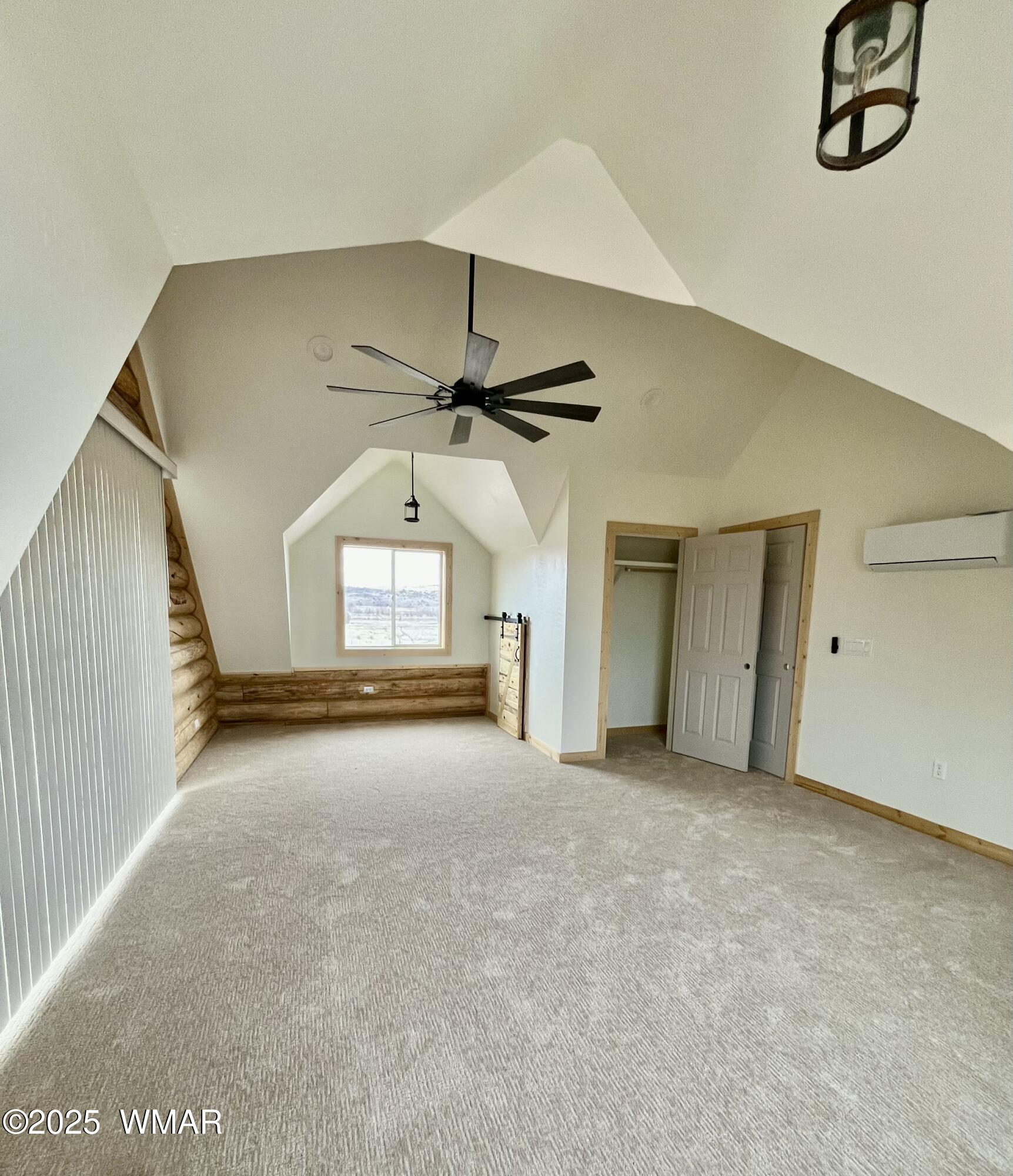 446 Becker Lake Road Springerville, AZ 85938 - Photo 12 of 18 an empty room with ceiling fan and windows