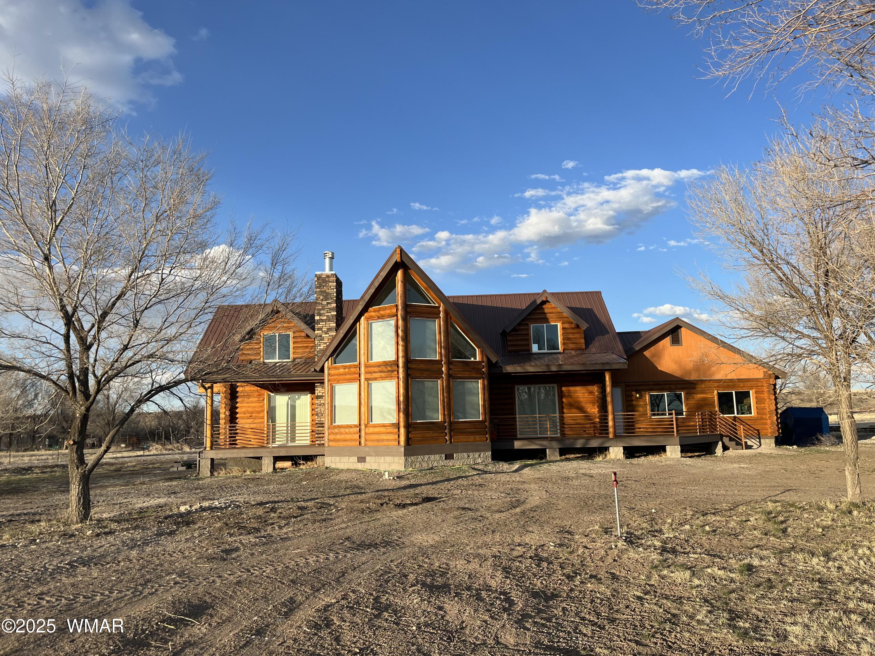 446 Becker Lake Road Springerville, AZ 85938 - Photo 2 of 18 a front view of a house with a yard