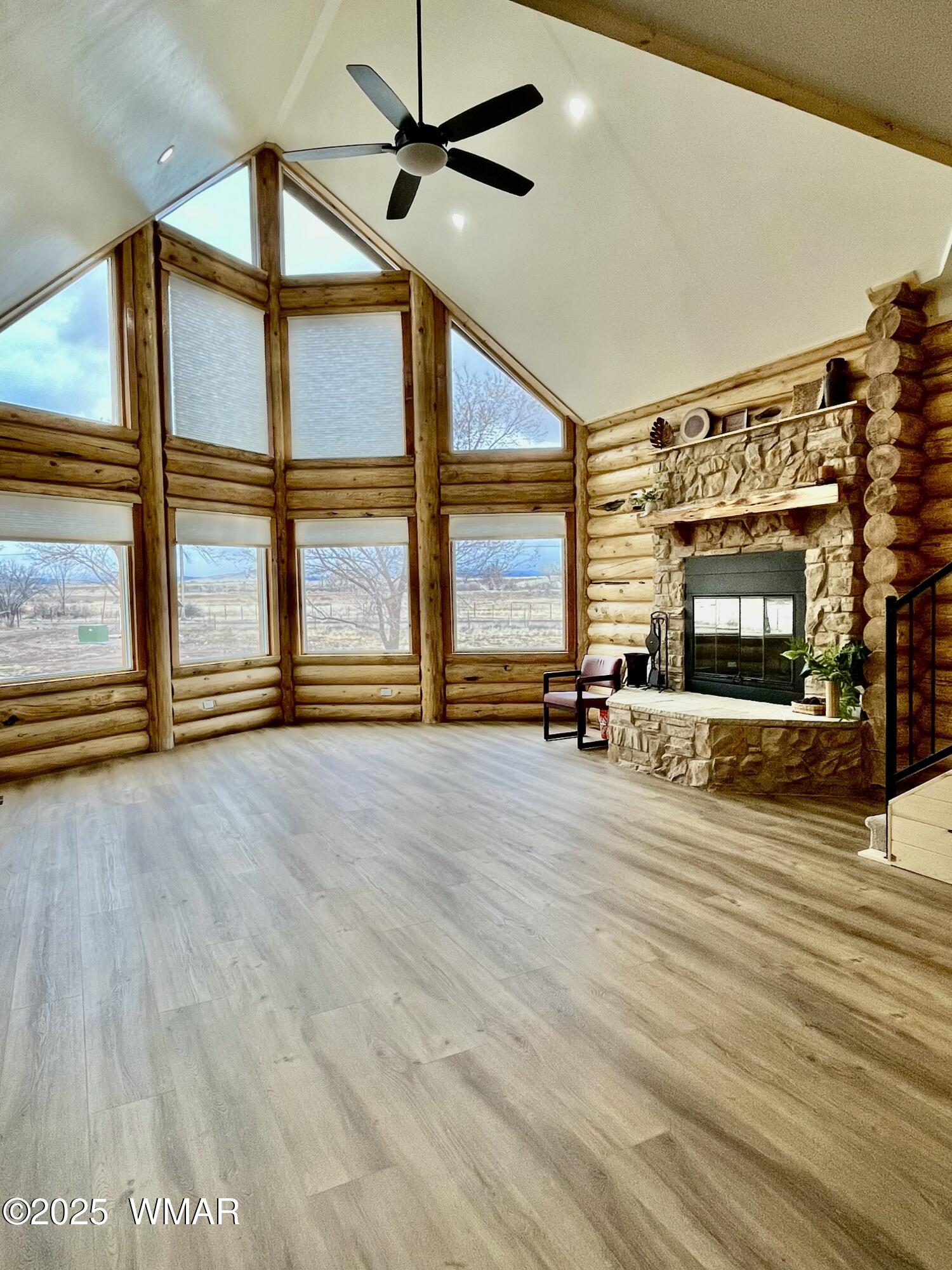 446 Becker Lake Road Springerville, AZ 85938 - Photo 4 of 18 wooden floor ceiling fan and windows