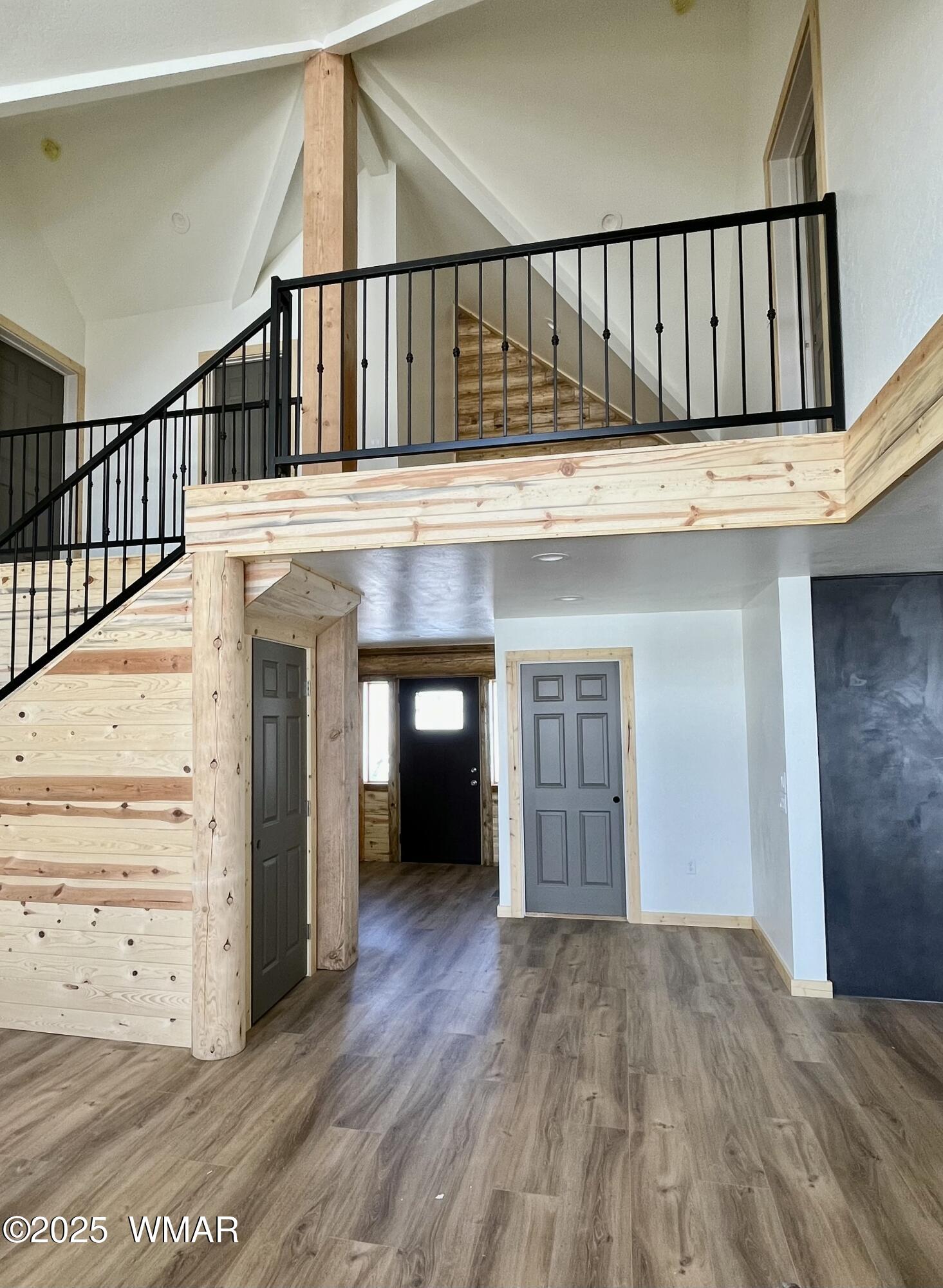 446 Becker Lake Road Springerville, AZ 85938 - Photo 5 of 18 a view of a hallway with wooden floor and staircase