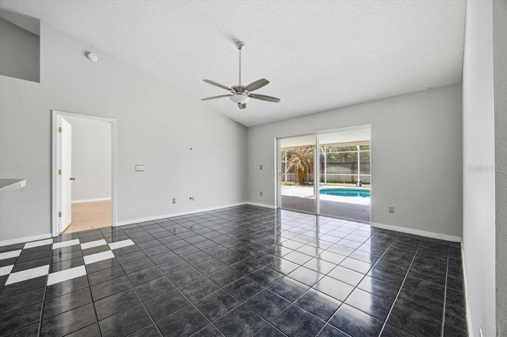 364 Nevada Loop Road Davenport, FL 33897 - Photo 12 of 26 a view of an empty room with a window