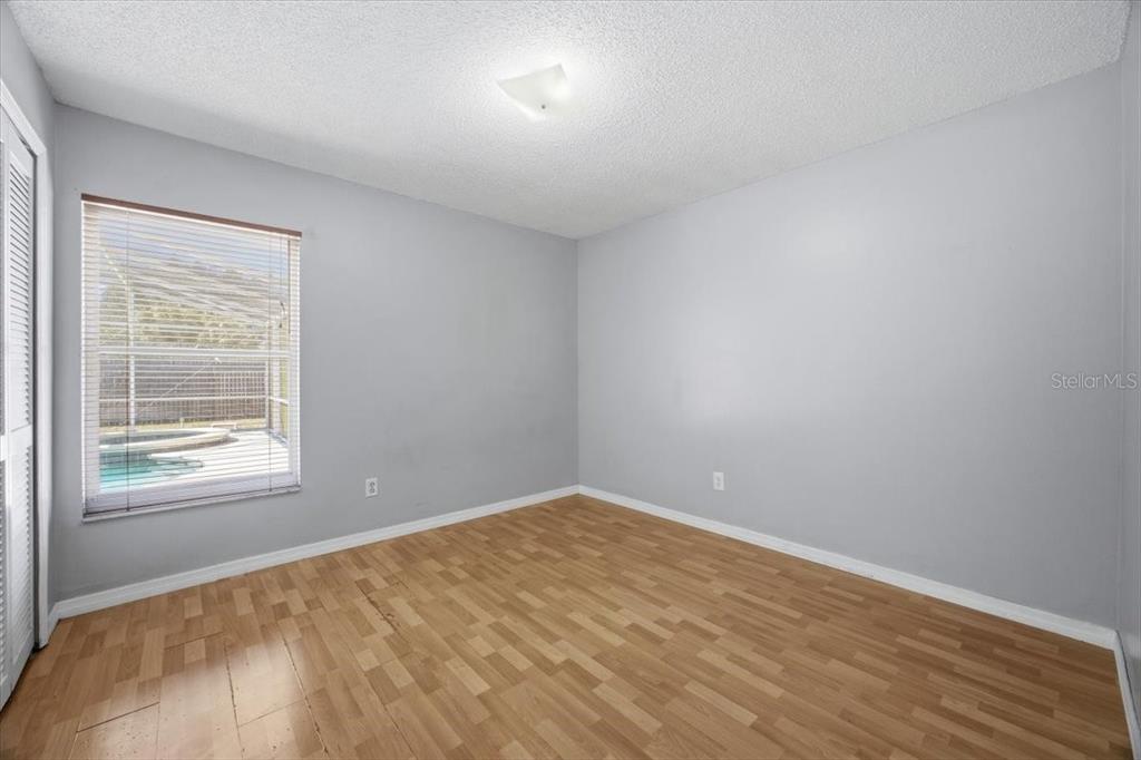 364 Nevada Loop Road Davenport, FL 33897 - Photo 17 of 26 an empty room with a window