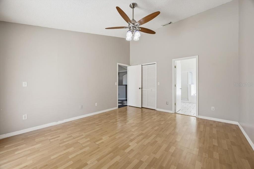 364 Nevada Loop Road Davenport, FL 33897 - Photo 19 of 26 wooden floor in an empty room