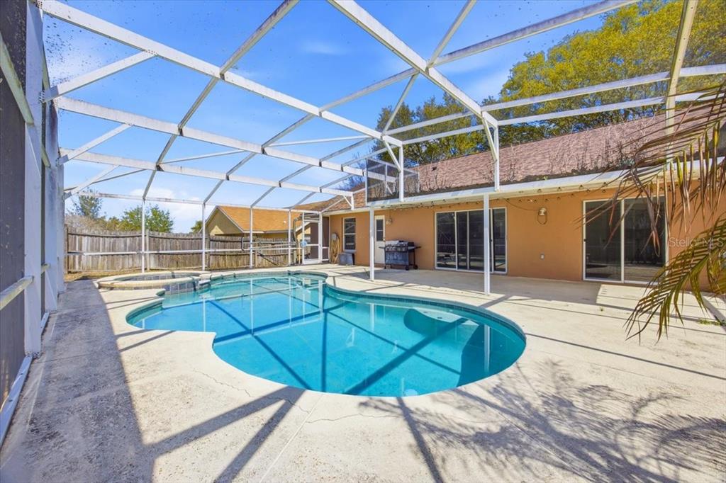 364 Nevada Loop Road Davenport, FL 33897 - Photo 23 of 26 a view of a backyard with a swimming pool