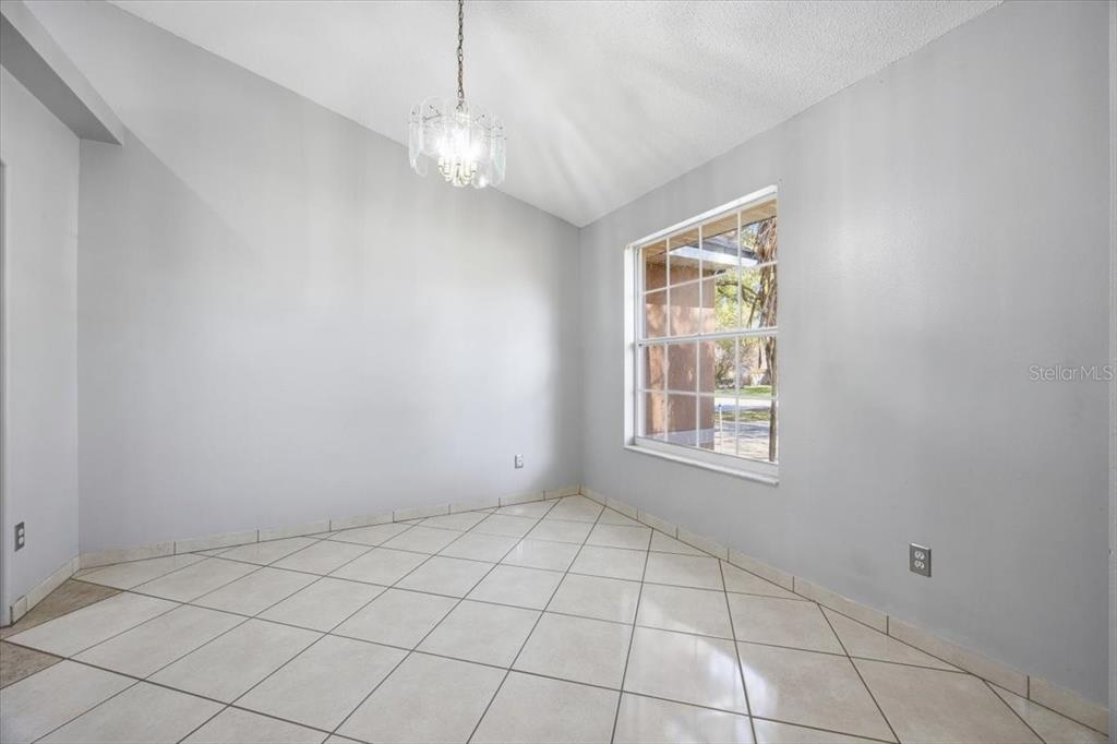364 Nevada Loop Road Davenport, FL 33897 - Photo 5 of 26 a view of an empty room with a window