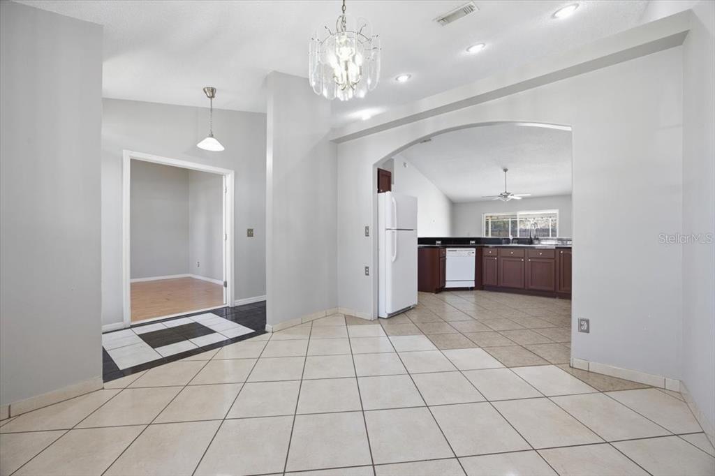 364 Nevada Loop Road Davenport, FL 33897 - Photo 6 of 26 a view of a kitchen with a sink and cabinets