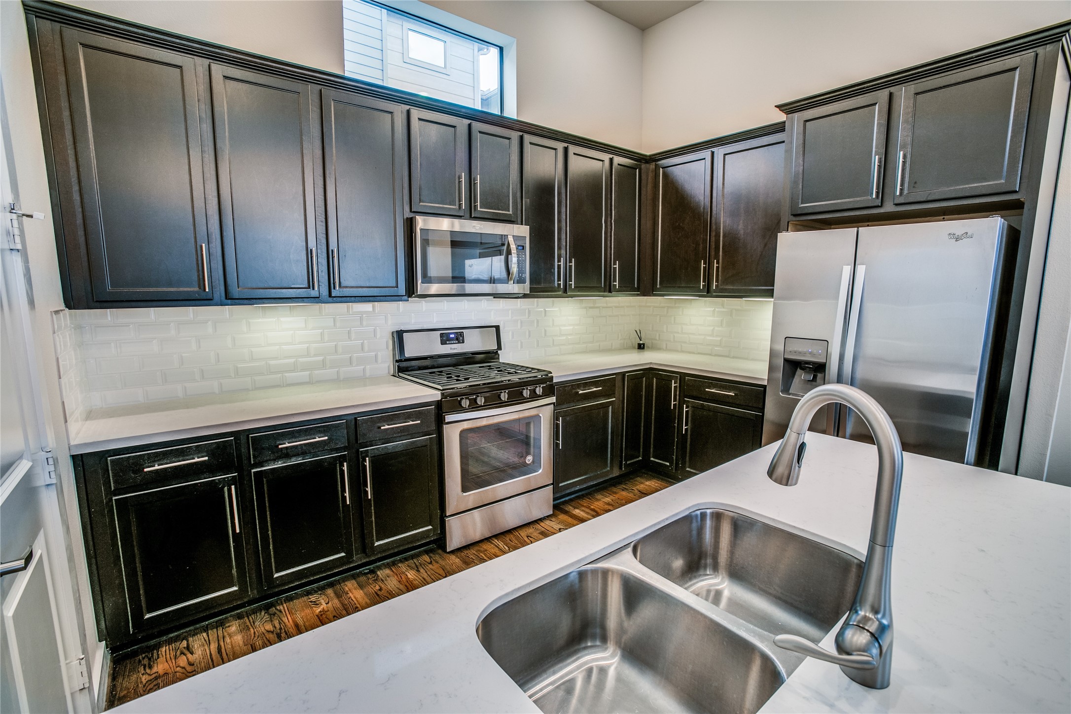 1508 Beall Street Houston, TX 77008 - Photo 19 of 38 a kitchen with granite countertop a sink stove and refrigerator