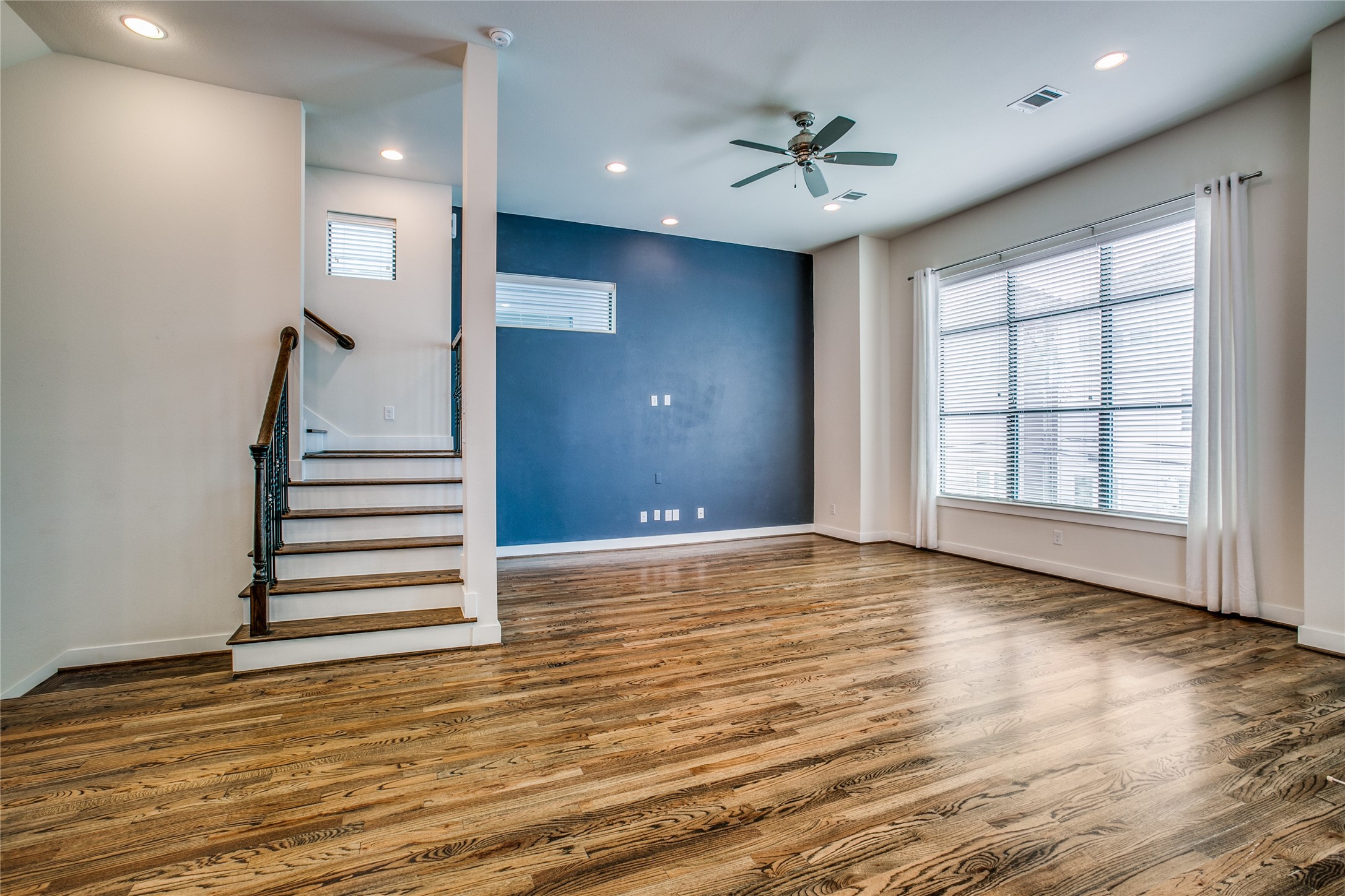 1508 Beall Street Houston, TX 77008 - Photo 2 of 38 wooden floor in an empty room with a window