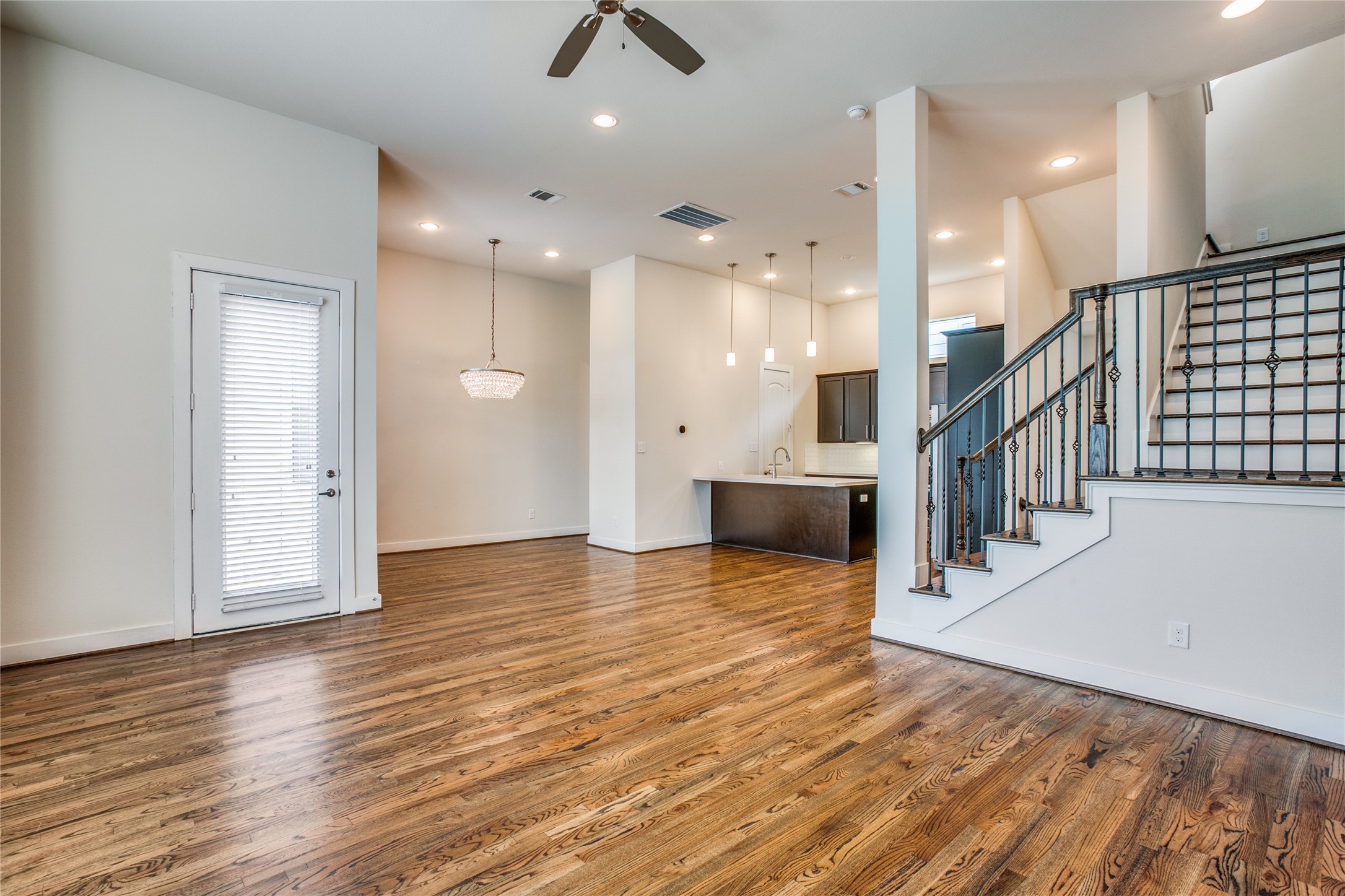 1508 Beall Street Houston, TX 77008 - Photo 3 of 38 an empty room with wooden floor and windows