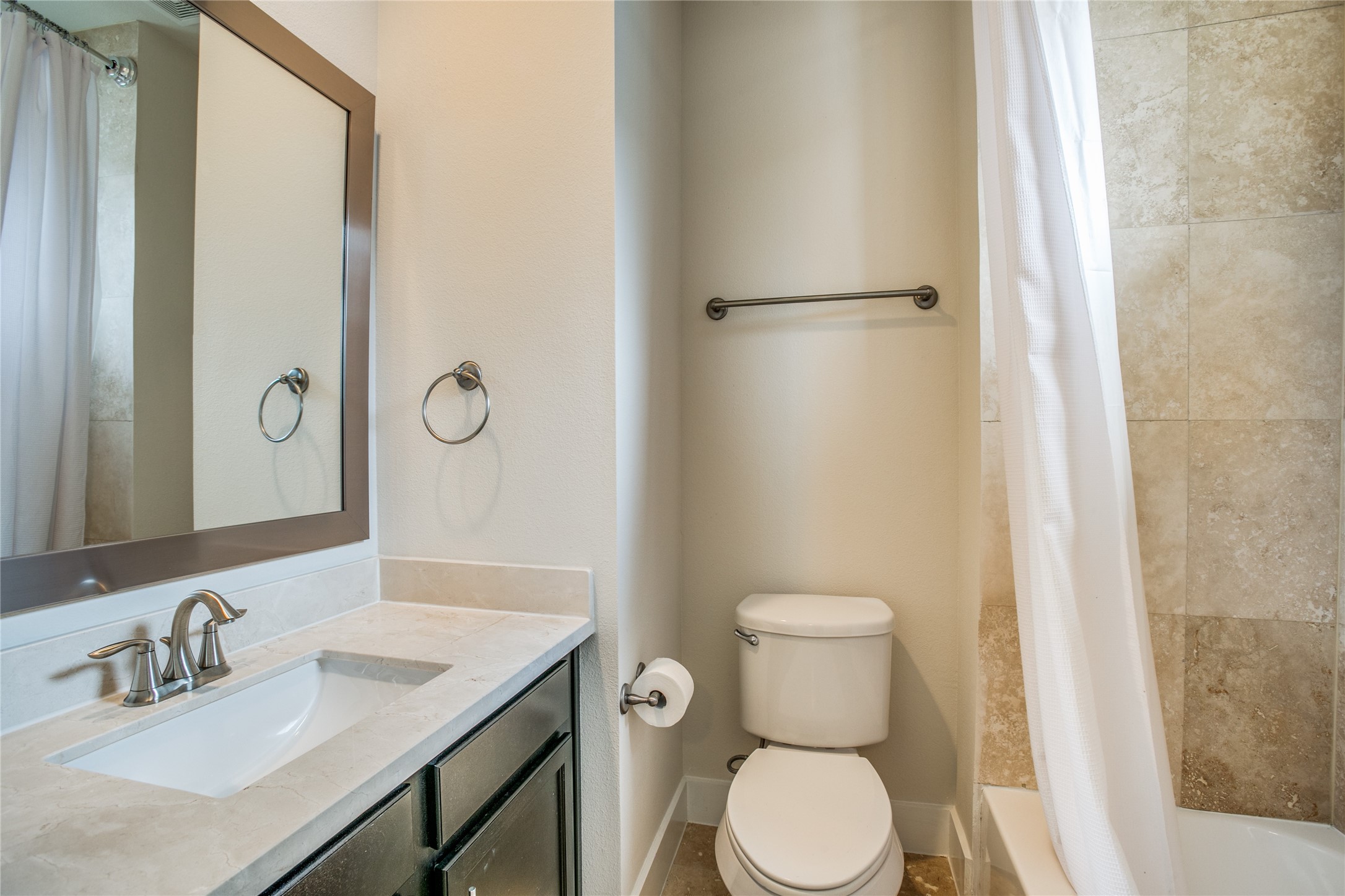 1508 Beall Street Houston, TX 77008 - Photo 35 of 38 a bathroom with a granite countertop toilet sink and mirror