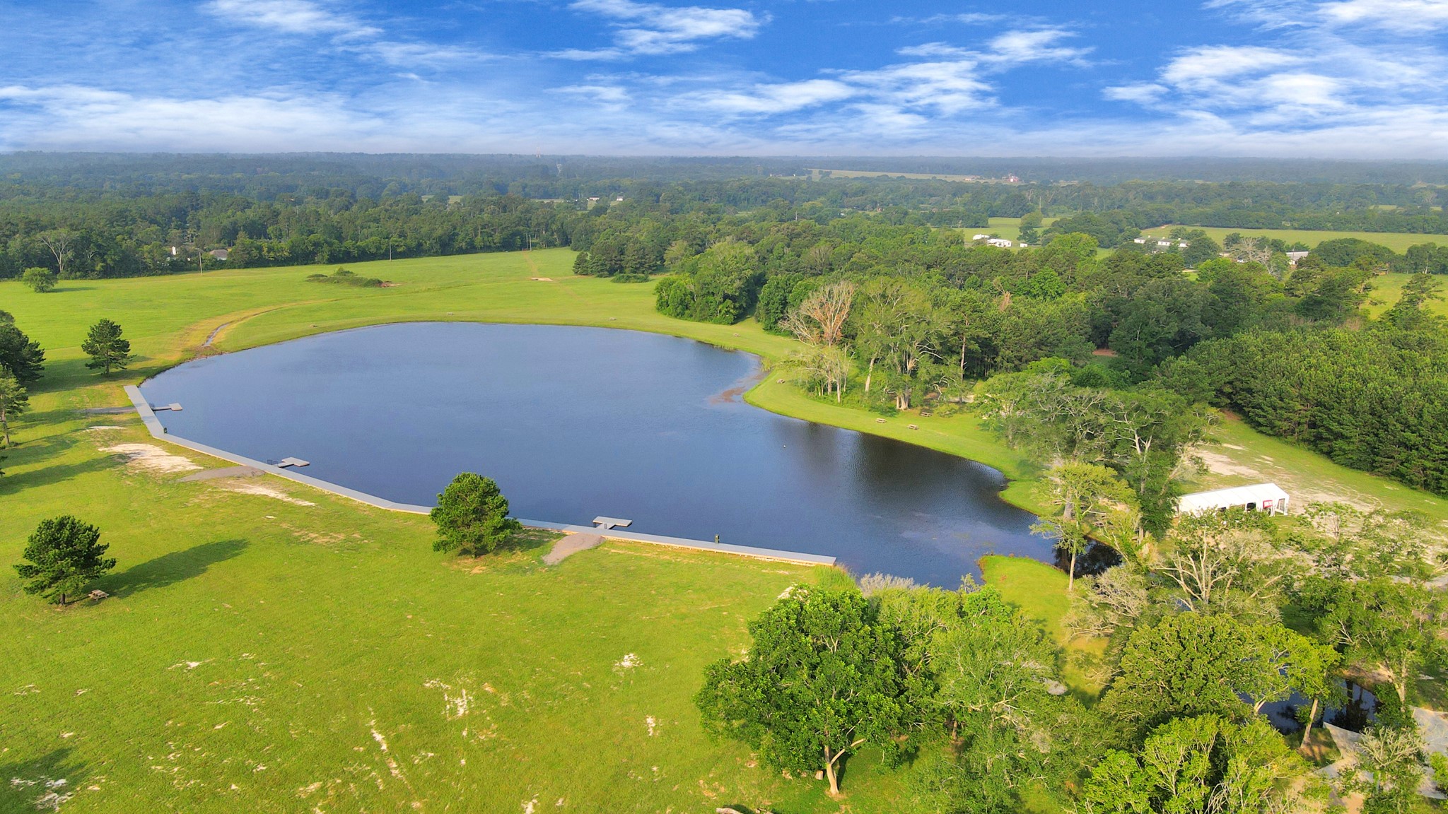 15365 Red Hawk Road Willis, TX 77378 - Photo 6 of 18 a view of a lake with a yard