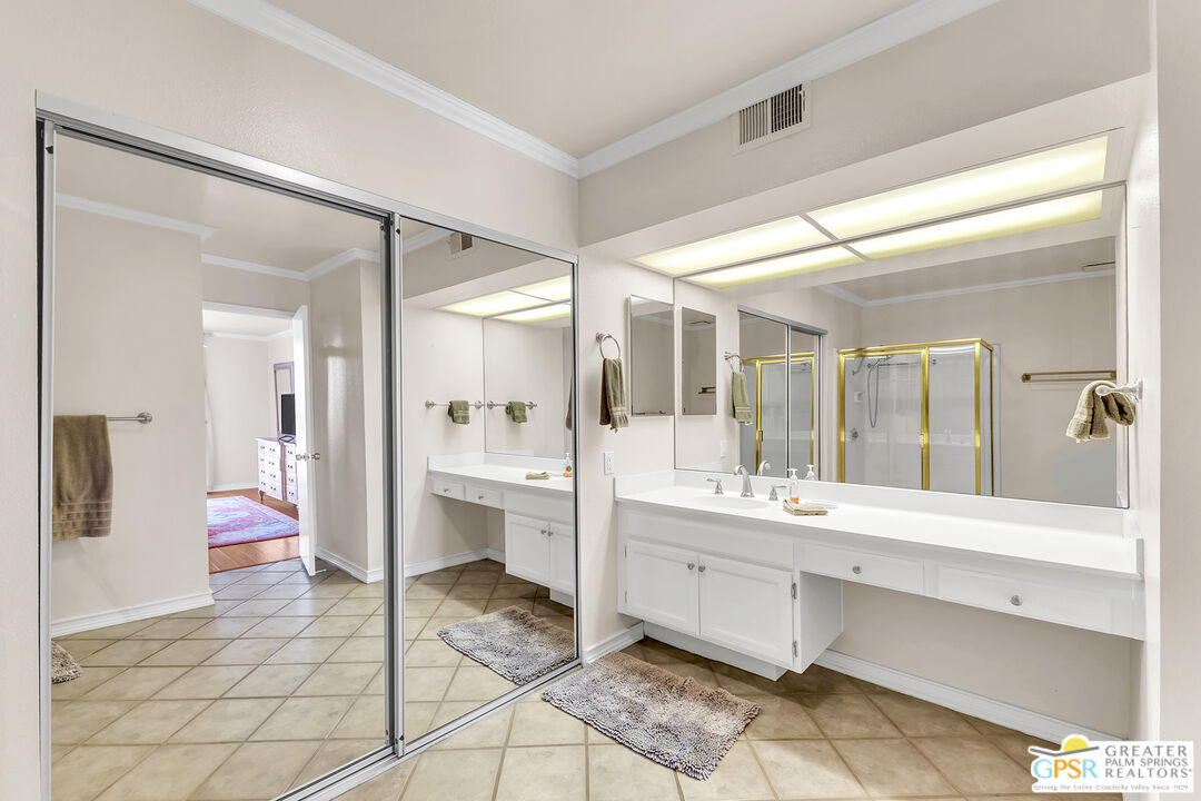 28 Calle Encinitas Rancho Mirage, CA 92270 - Photo 13 of 57 a bathroom with a sink mirror and a bath tub