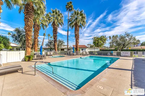 a view of a swimming pool with a porch