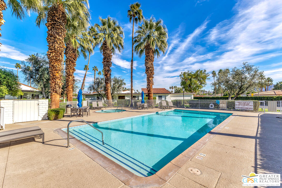 28 Calle Encinitas Rancho Mirage, CA 92270 - Photo 18 of 57 a view of a swimming pool with a patio and a yard