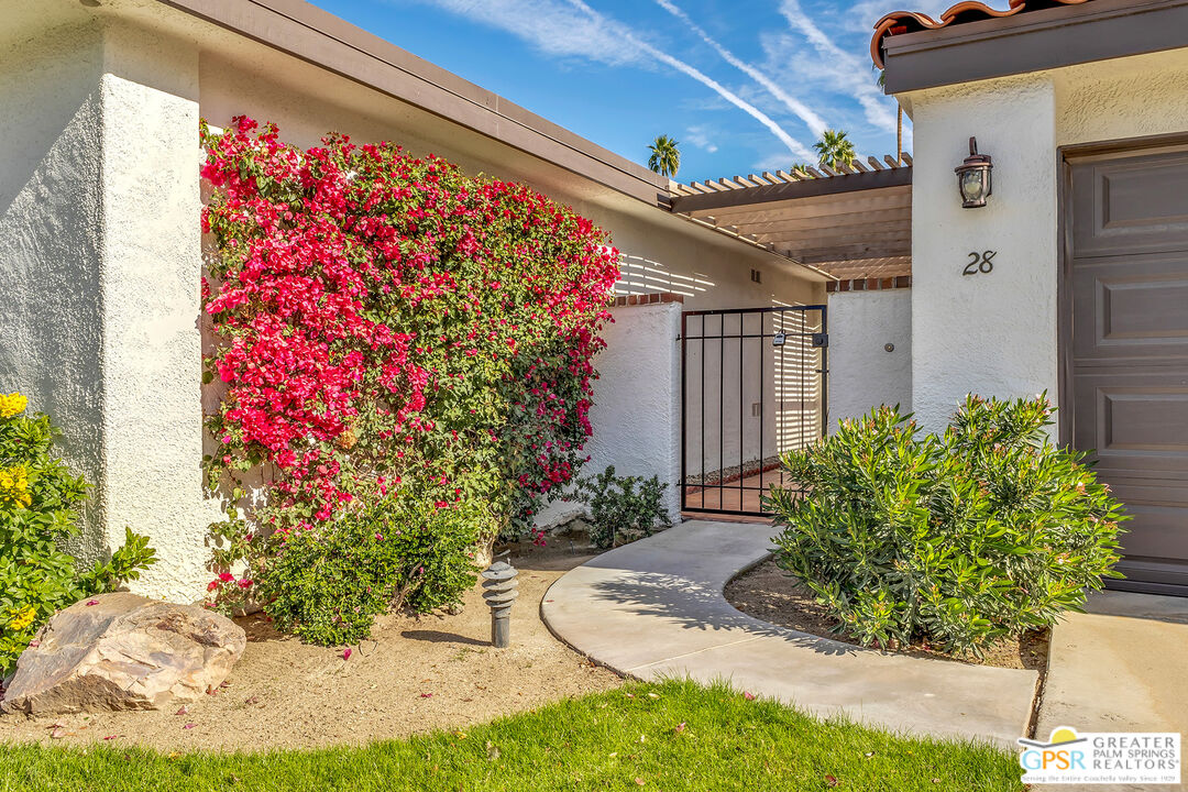 28 Calle Encinitas Rancho Mirage, CA 92270 - Photo 2 of 57 a front view of a house with a yard