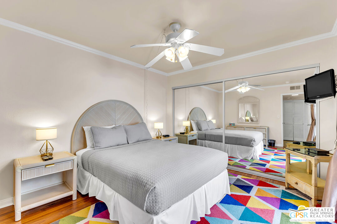 28 Calle Encinitas Rancho Mirage, CA 92270 - Photo 41 of 57 a bedroom with bed and a chandelier