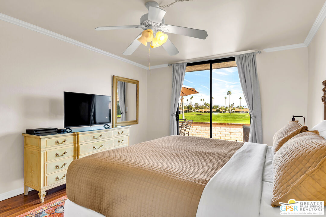 28 Calle Encinitas Rancho Mirage, CA 92270 - Photo 45 of 57 a bedroom with a bed and a flat tv screen on dresser