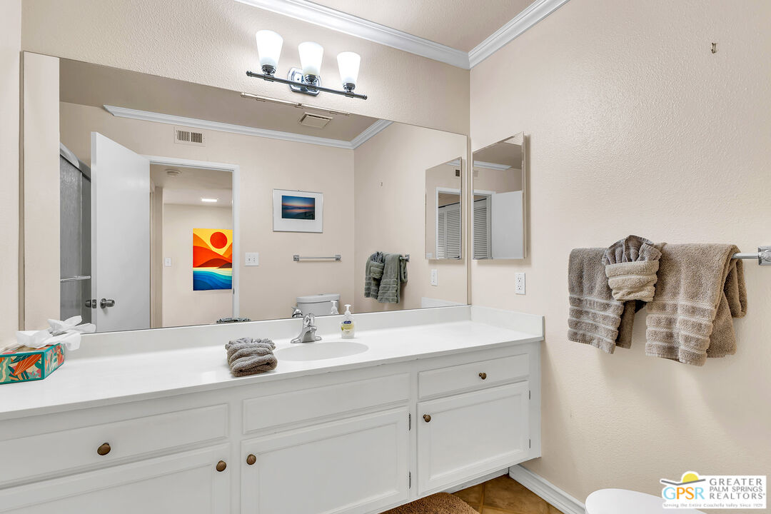 28 Calle Encinitas Rancho Mirage, CA 92270 - Photo 10 of 57 a bathroom with a sink double vanity and mirror