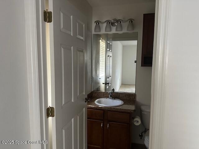5632 Talbot Boulevard Cocoa, FL 32926 - Photo 8 of 12 a bathroom with a sink and a mirror