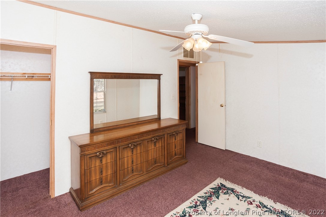 490 Loop Road Raeford, NC 28376 - Photo 35 of 50 a view of a hallway with a chandelier