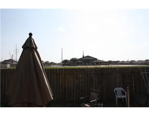 a view of balcony with furniture