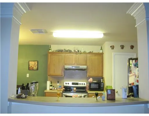 a view of a bathroom with sink and mirror