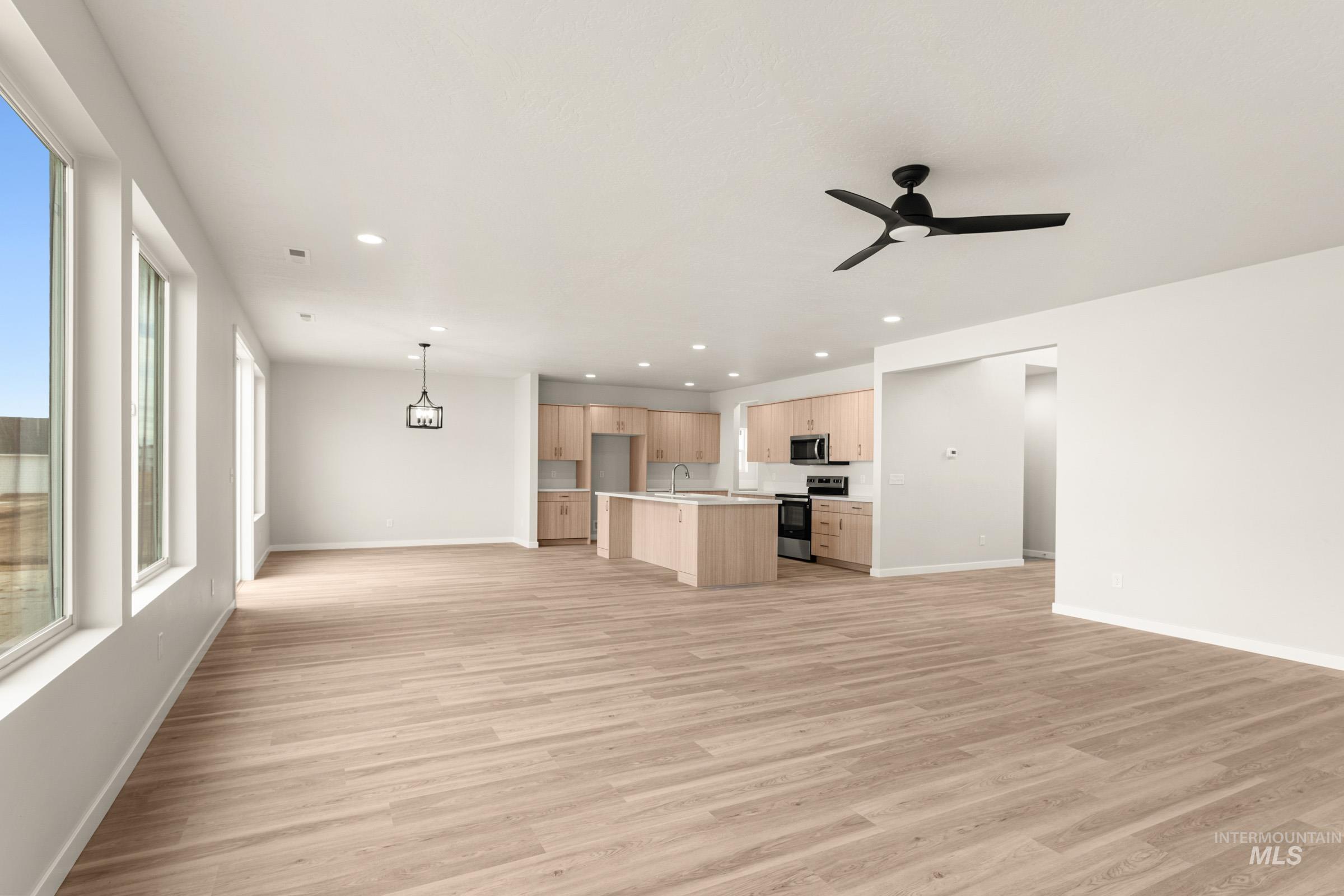 13688 Redway Court Caldwell, ID 83607 - Photo 11 of 26 Unfurnished living room with recessed lighting, light wood-style flooring, and ceiling fan