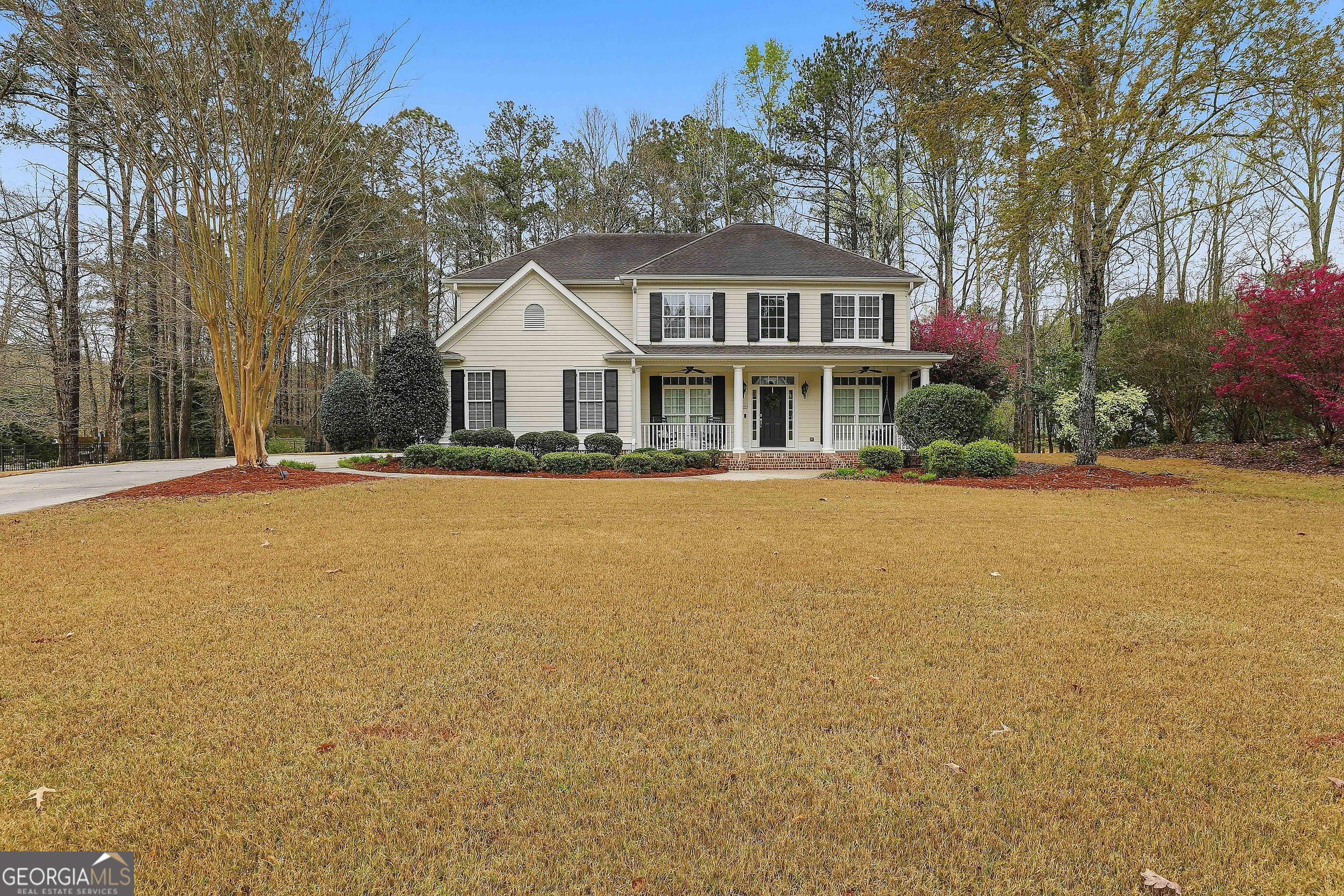 108 Tullamore Trail Tyrone, GA 30290 - Photo 2 of 54 a front view of house with yard and trees around
