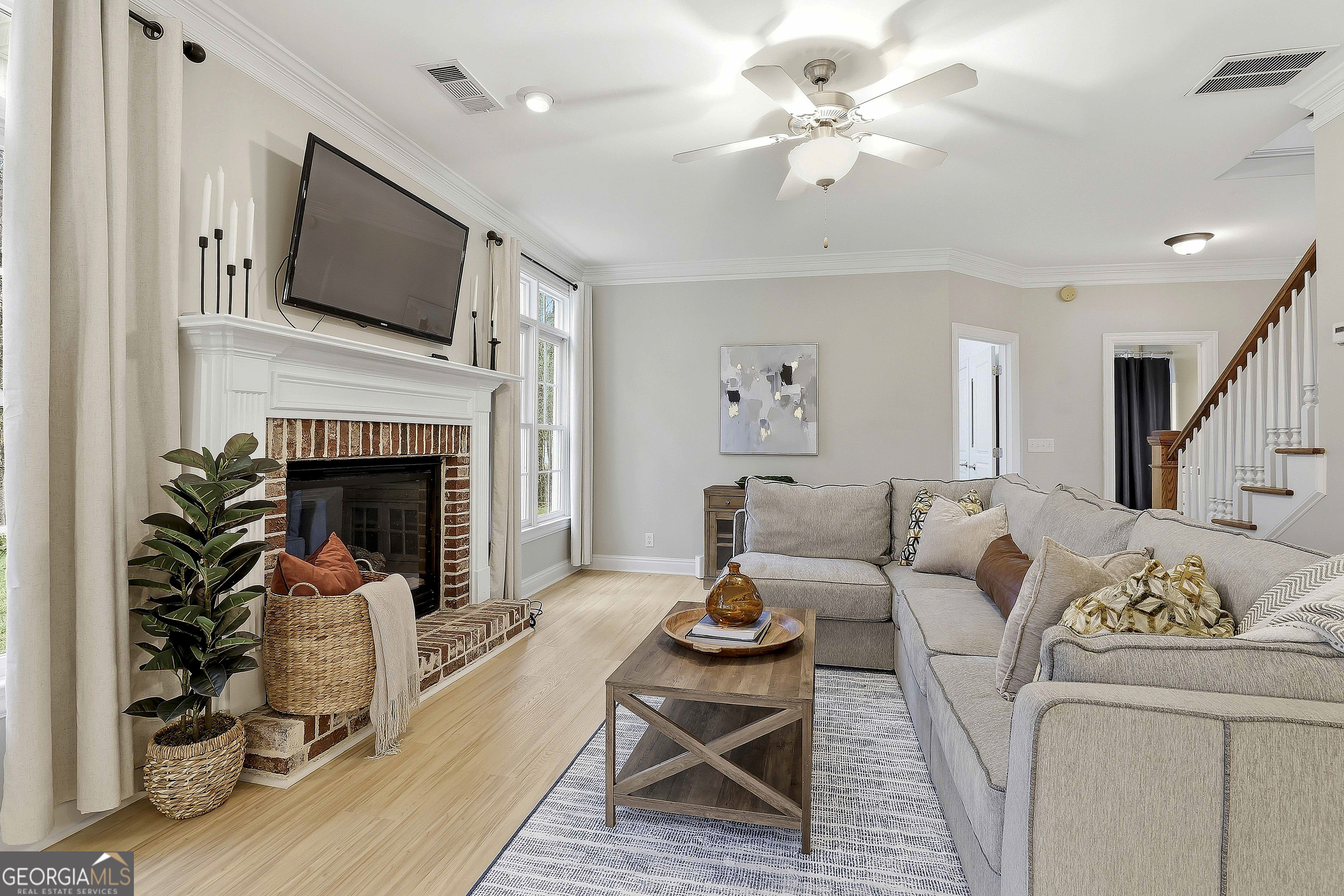 108 Tullamore Trail Tyrone, GA 30290 - Photo 24 of 54 a living room with furniture fireplace and flat screen tv