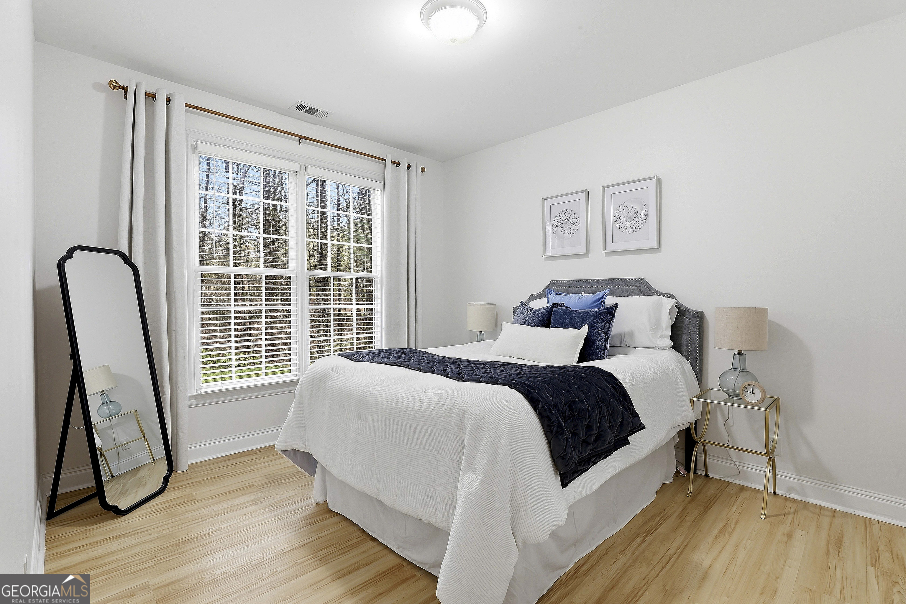 108 Tullamore Trail Tyrone, GA 30290 - Photo 31 of 54 a bedroom with a bed a couch and a window