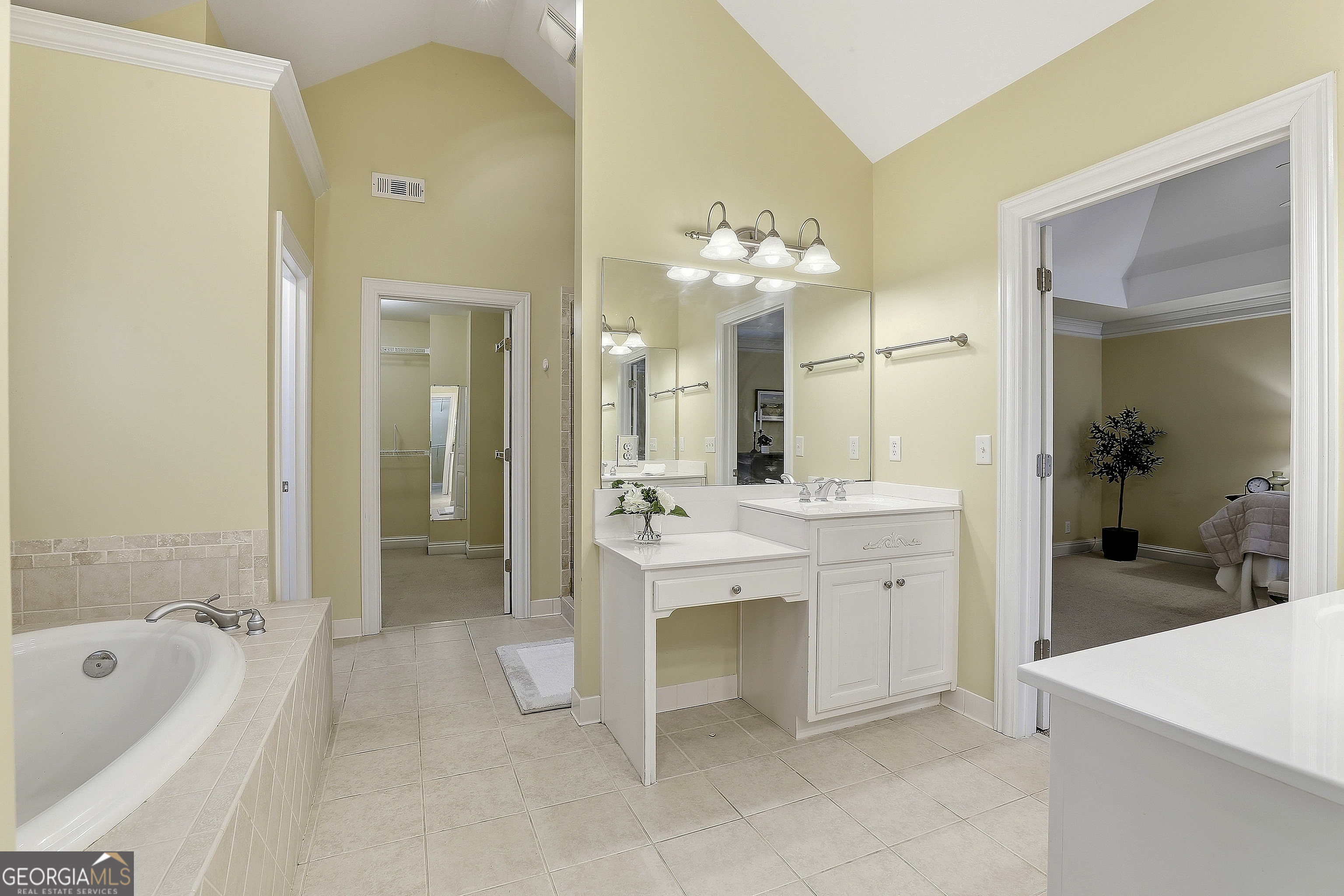 108 Tullamore Trail Tyrone, GA 30290 - Photo 37 of 54 a spacious bathroom with a sink a mirror a bathtub and shower