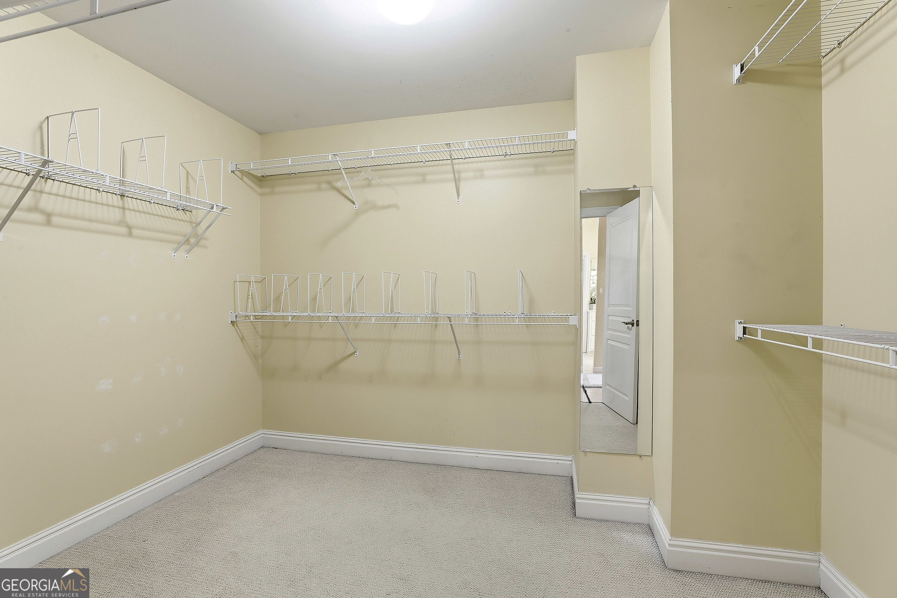 108 Tullamore Trail Tyrone, GA 30290 - Photo 39 of 54 a bathroom with a glass shower door