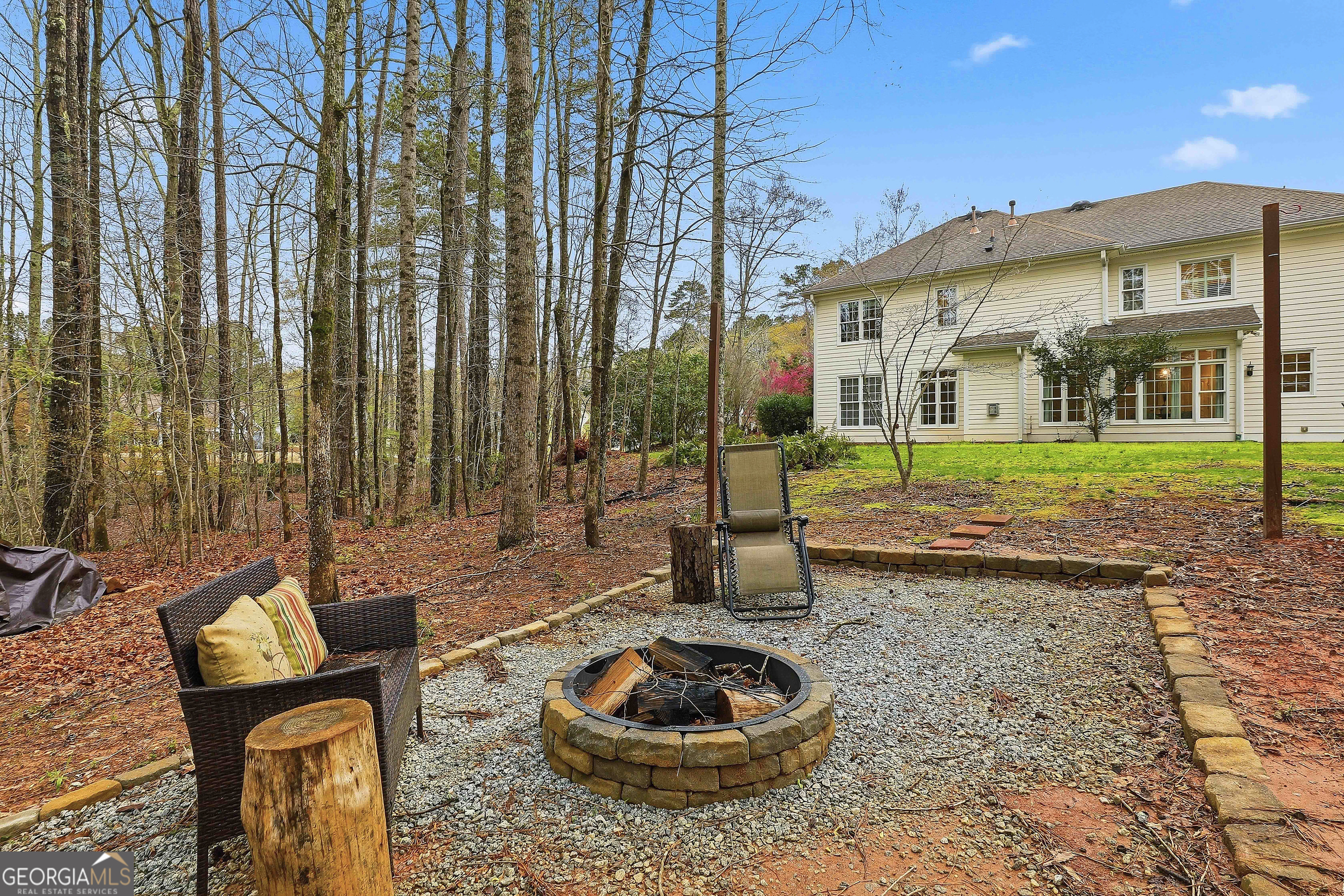 108 Tullamore Trail Tyrone, GA 30290 - Photo 52 of 54 a backyard of a house with barbeque oven table and chairs