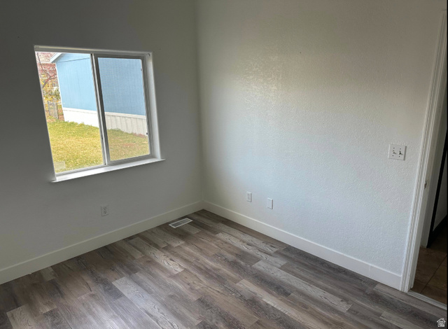 265 Mindella Way Layton, UT 84041 - Photo 17 of 32 Room featuring wood-finish flooring, crisp white baseboards, and a large window