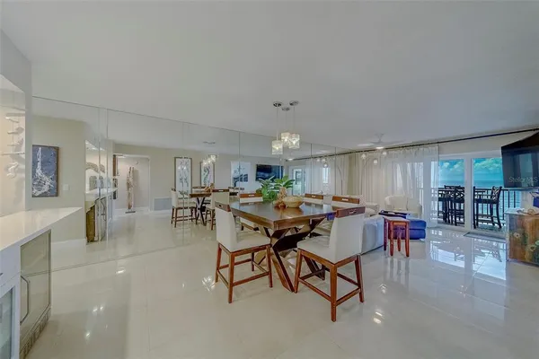 a bedroom with furniture and a flat screen tv