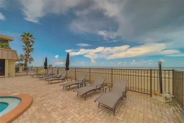 a view of a balcony with two chairs