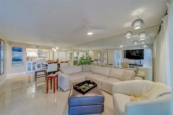 a kitchen with white cabinets sink and stainless steel appliances