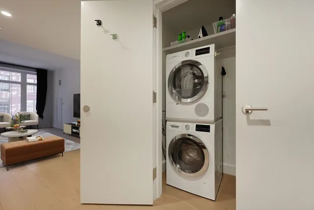 a utility room with sink washer and dryer