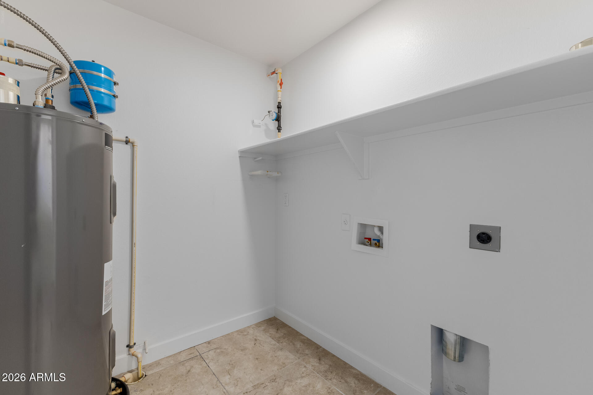 2511 West Queen Creek Road, Unit 279 Chandler, AZ 85248 - Photo 19 of 35 a view of a storage & utility room with a refrigerator