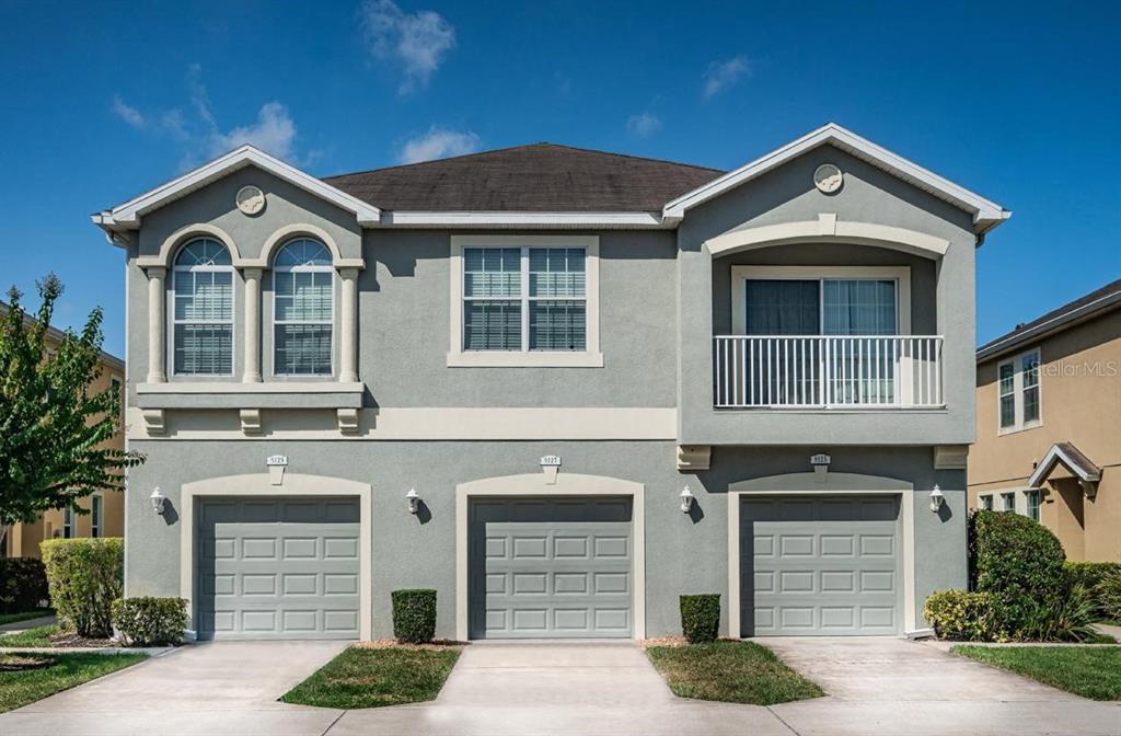 9127 Moonlit Meadows Loop Riverview, FL 33578 - Photo 1 of 1 a front view of a house with yard and parking