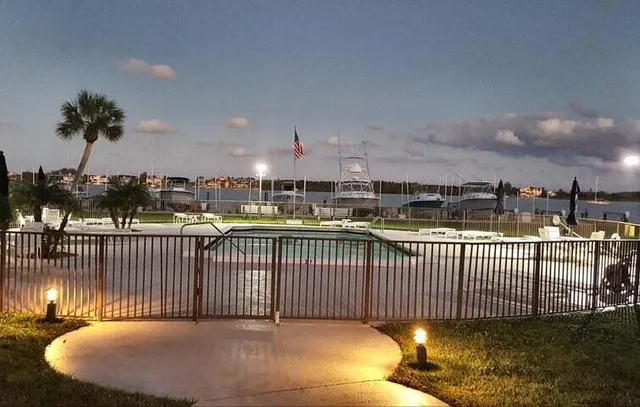 a bathroom with a shower a toilet and sink