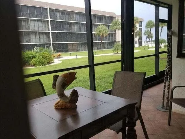 a view of swimming pool with outdoor seating and plants