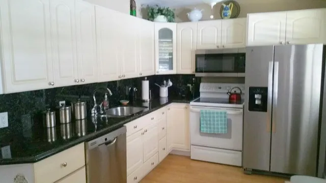 a view of a dining room with furniture and a chandelier