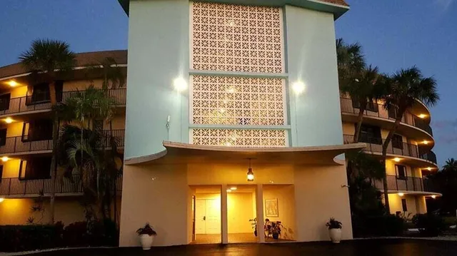 a bedroom with a bed and a closet with mirror