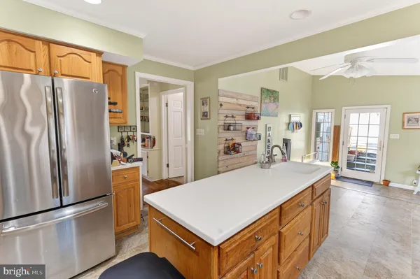 a kitchen with stainless steel appliances a refrigerator and a stove