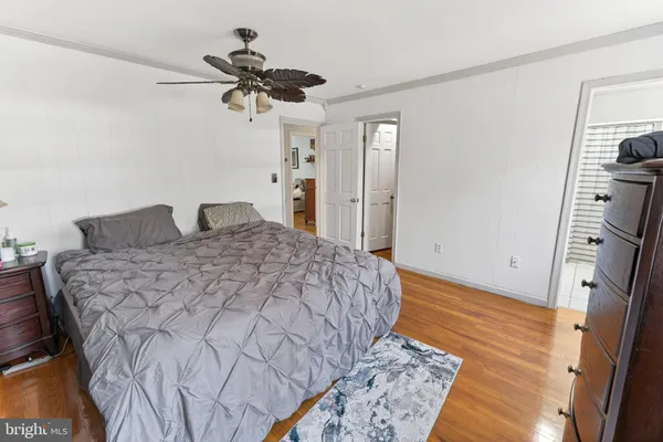 a view of walk in closet with clothes
