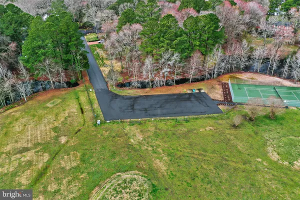 a view of a swimming pool with a yard